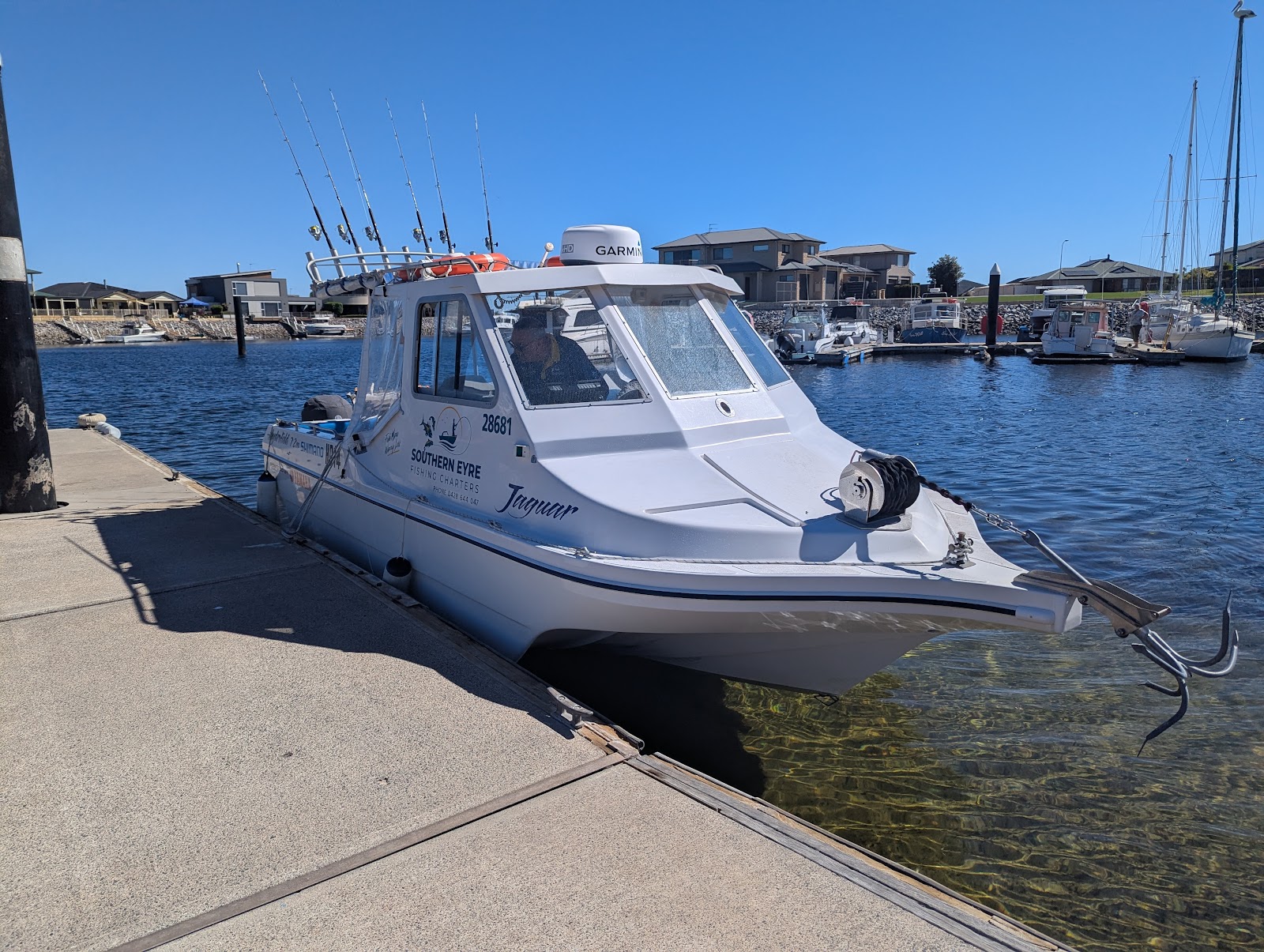 The Southern Eyre Fishing Charters boat tied up at the jetty on a sunny day